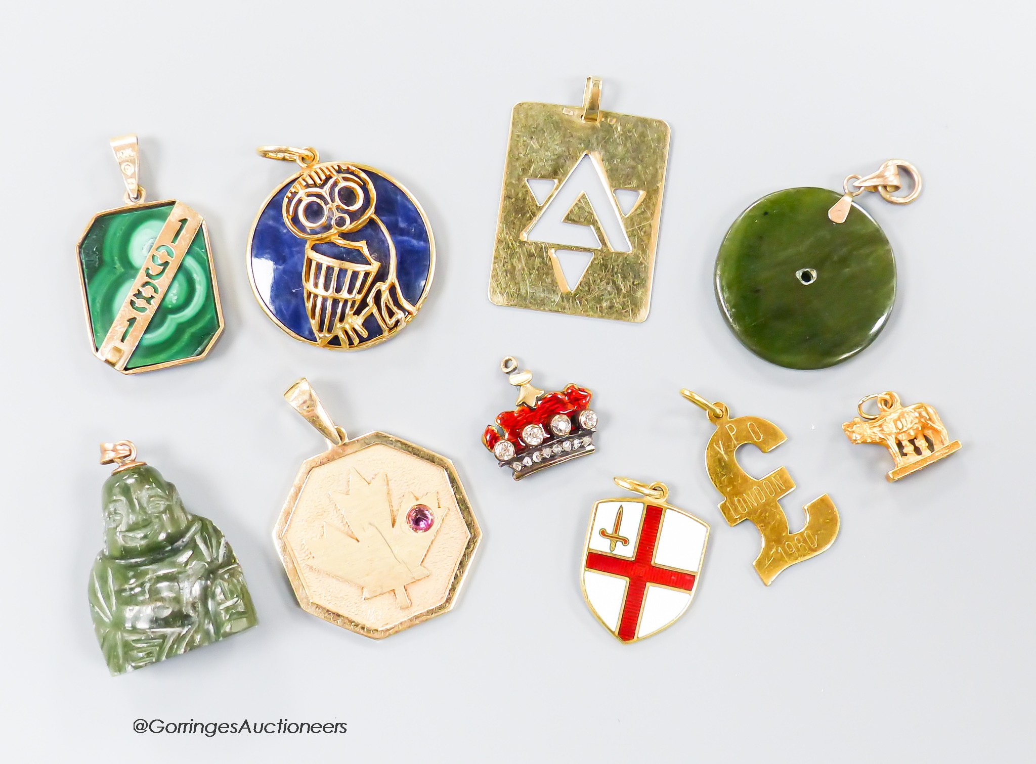 A small collection of ten assorted mainly yellow metal and gem set pendants including a red enamel and diamond set coronet pendant 15mm and an 18k mounted nephrite pendant, one other stamped 14k, 7.4 grams and a 9ct and